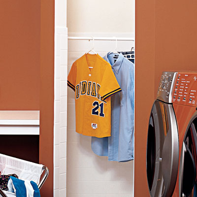 shower stall with hanging rod in family room laundry room
