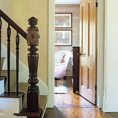 a staircase that focuses on the balustrade and newel post