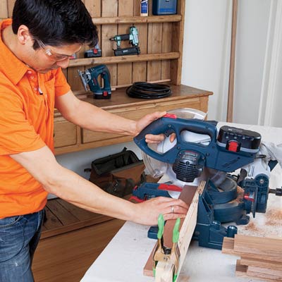 man using power saw