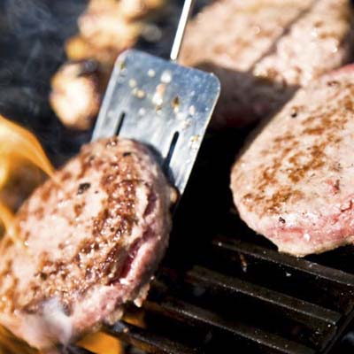 burgers cooking on the grill