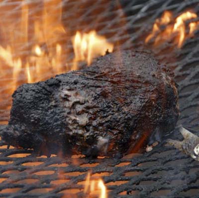 blackened steak on the grill
