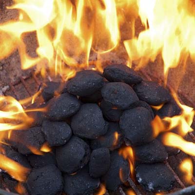 burning charcoal in an outdoor grill