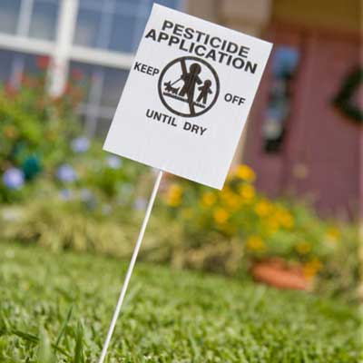 lawn with pesticide warning sign