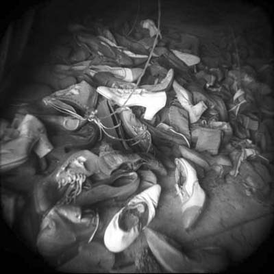 old dress shoes scattered across ruined mansion floor
