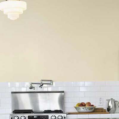 salvaged white tile for backsplash in sustainable home's kitchen