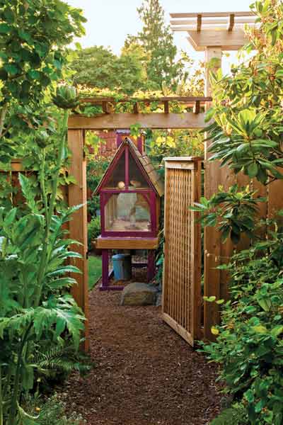sustainable garden; with permeable pavers, outdoor aviary contrcuted by homeowner, adn drought-resistant plantings
