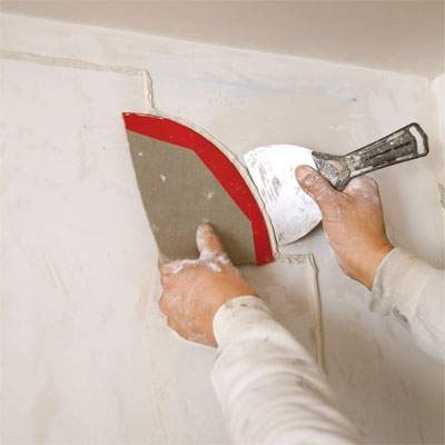 comparing new plaster detail to old during the toh tv los angeles house project remodel