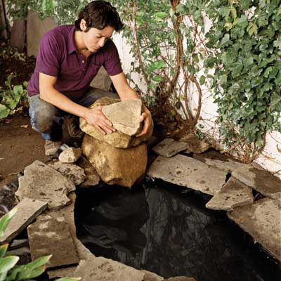 Mark Powers installing a backyard pond