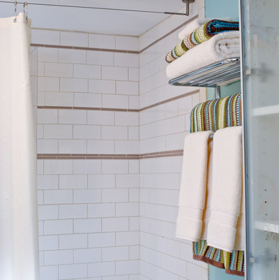 remodeled bathroom with smart storage towel racks