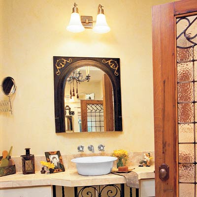 bathroom with salvaged mirror surround