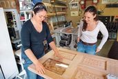 woman building salvage furniture