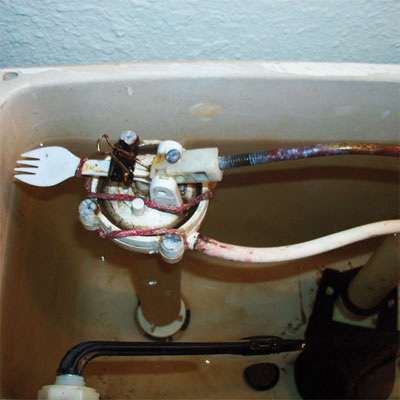 spork used to repair a toilet tank