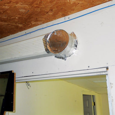 ductwork made from a downspout and a food can