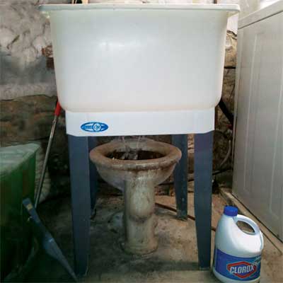 utility sink installed directly over old toilet