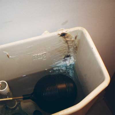 caulk used to repair a crack in a water-filled toilet tank