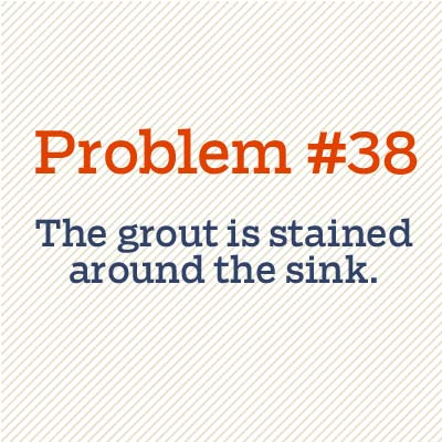 grout is stained around sink
