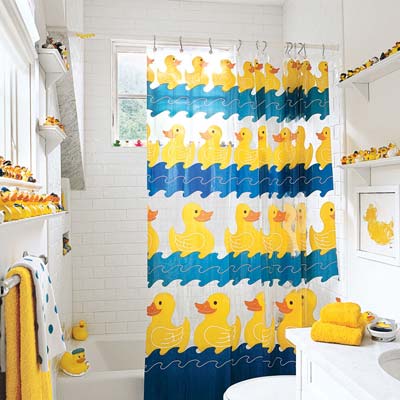 bathroom with rubber ducky shower curtain and shelves of rubber ducks