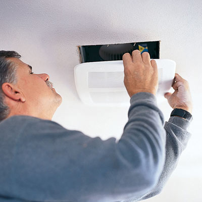 tom silva installing a bathroom vent fan