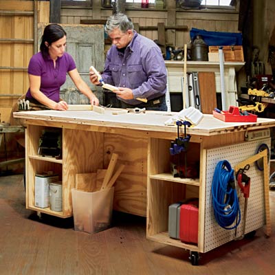 Tom Silva standing at diy built tool bench