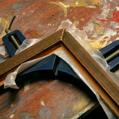 using wax paper as a drip guard for adhesive