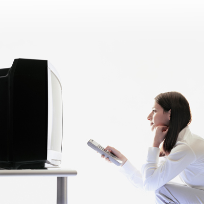 Woman watching a box television