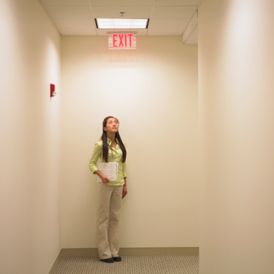 Woman looking at an Exit sign