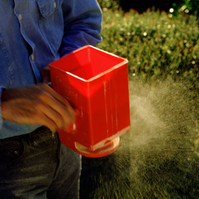 Man fertilizing a garden