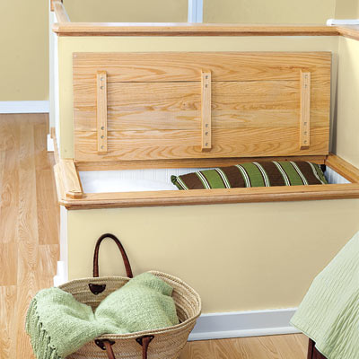 attic remodeled into master bedroom with built in storage bench