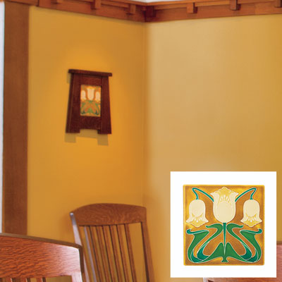 a Craftsman-style art tile on a dining room wall