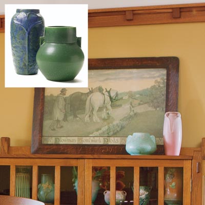 vintage-style pottery on top of a china cabinet in a dining room