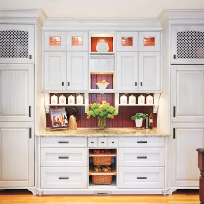 old world style kitchen with white cabinetry and cupboard refrigerators