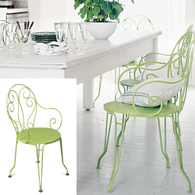 white country kitchen with ornate metal chairs