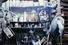 dusty basement shelves filled with old solvents and bottles