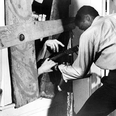 night of the living dead scene with zombie breaking in through window