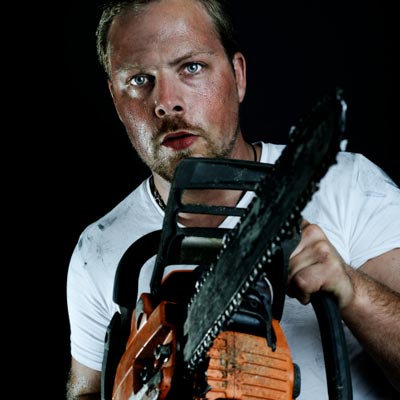 man wielding chainsaw