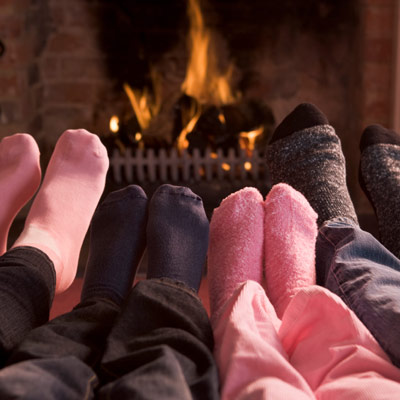 Family sitting by the fireplace