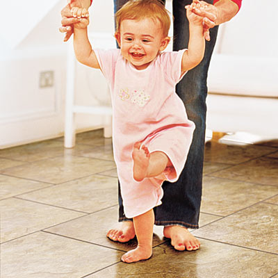 baby walking on vinyl flooring