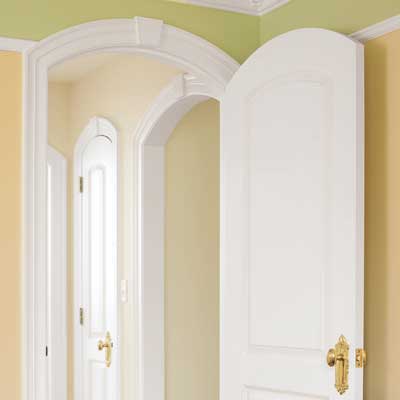 The Nursery's arched entryways with crown molding design