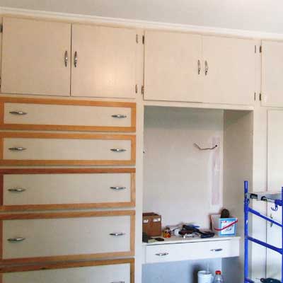 Home office with before the wall unit update 