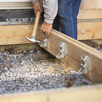 man building house foundation