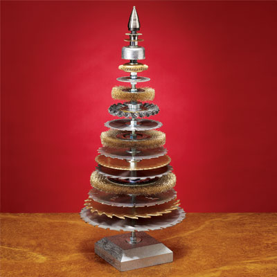 wire brushes and saw blades stacked together in the shape of a christmas tree