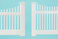 comparison shot of two vinyl picket fences from different price ranges