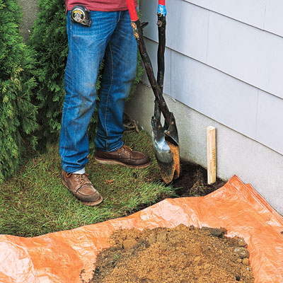 Digging the first posthole for the fence