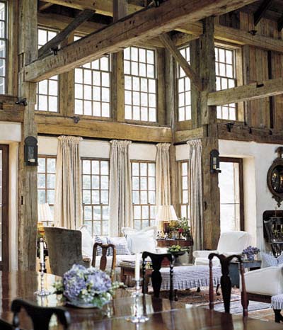 dining room in converted barn with exposed roof beams