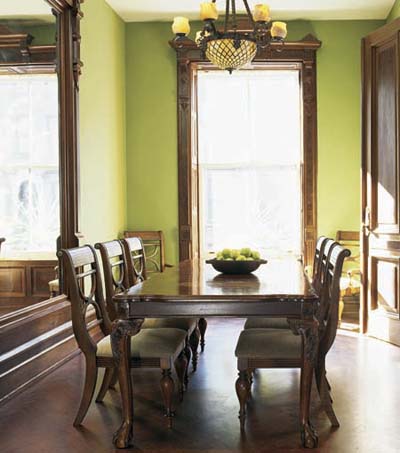 dining room in rescued Italianate townhouse with window trim and parquet floor