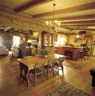 open-plan kitchen dining room in log cabin