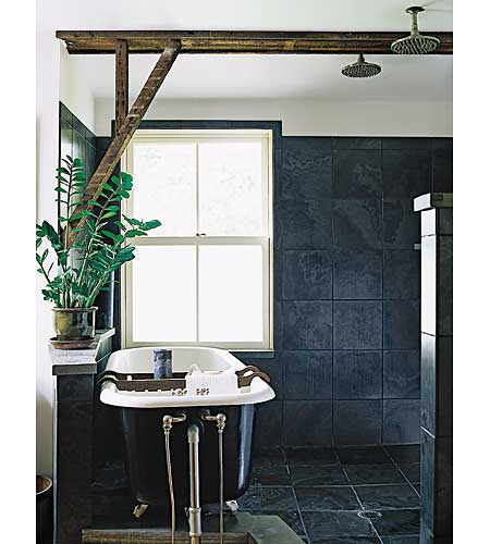 Bathroomwith claw-foot tub and multiple shower heads.