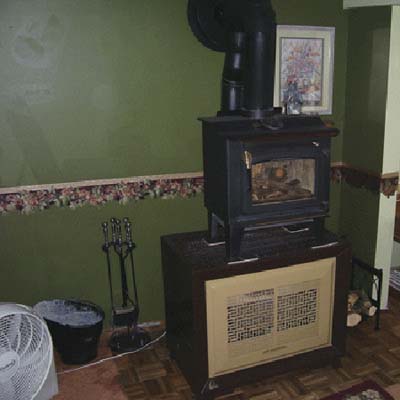 wood stove stacked on gas heater