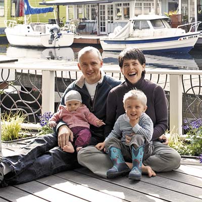 a family sitting on the deck