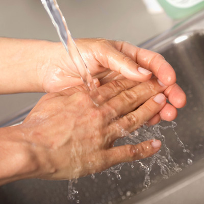 person washing hands 